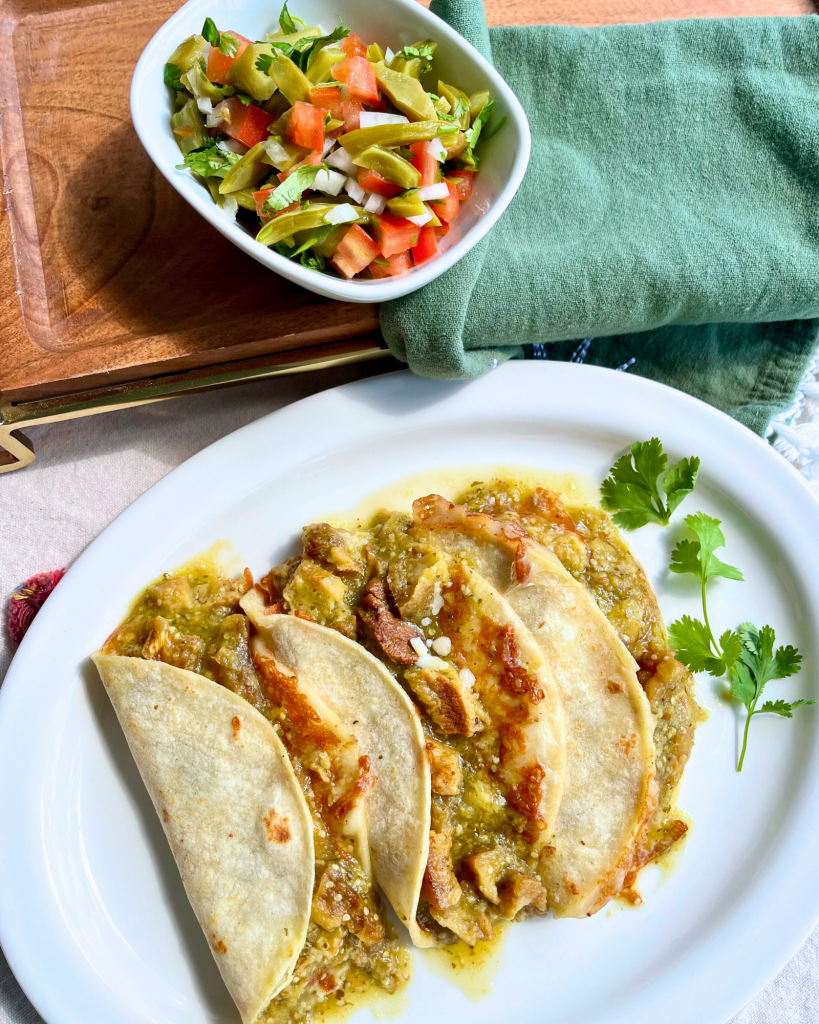 tacos de costra, crispy grated cheese melted, and chicharon in salsa verde, with a side of nopales (cactus salad)